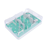 Interactive toy with green and white maze design and transparent walls, suitable for dexterity exercises.