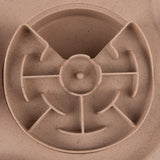 Round feeding maze made of beige plastic with several partitions for slow feeding.