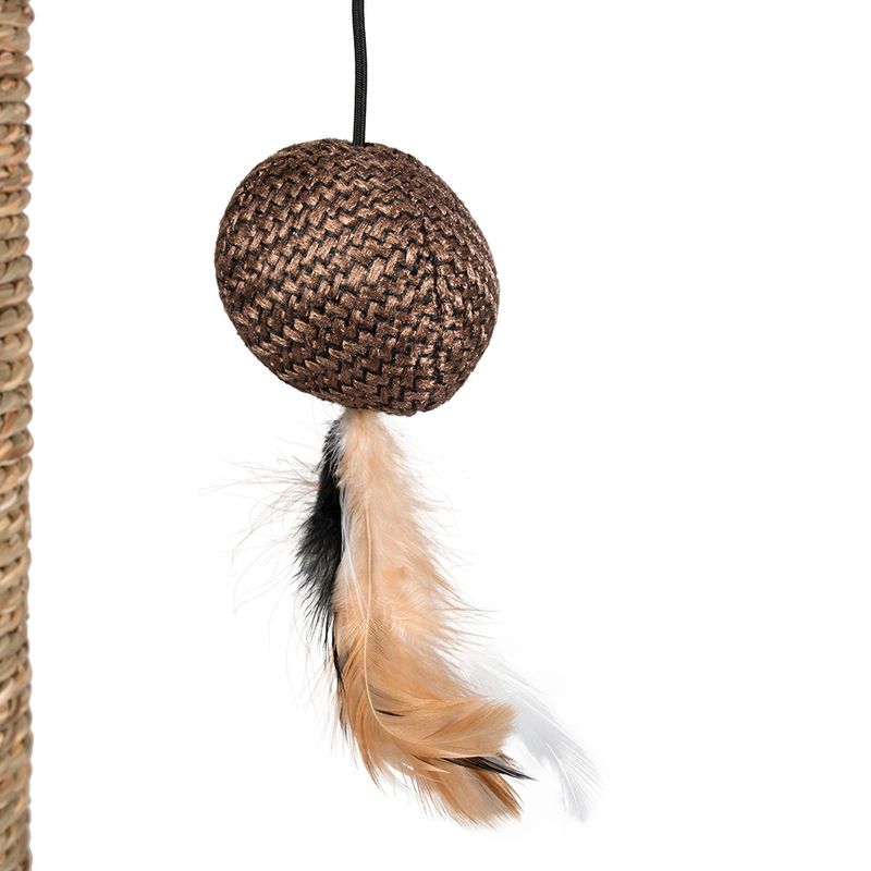 Brown toy made of braided material with beige and black feathers, attached to a string.