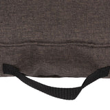 Close-up of brown fabric material with black carrying handle, possibly part of a pet bed or bag.