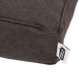 Close-up of a brown fabric cover with visible Trixie brand label.