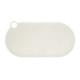 Oval, cream-coloured silicone mat with hole for hanging, suitable as a non-slip base for food bowls.