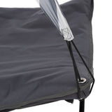 Close-up of a grey fabric cover with eyelets and elastic bands, attached to a metal frame.