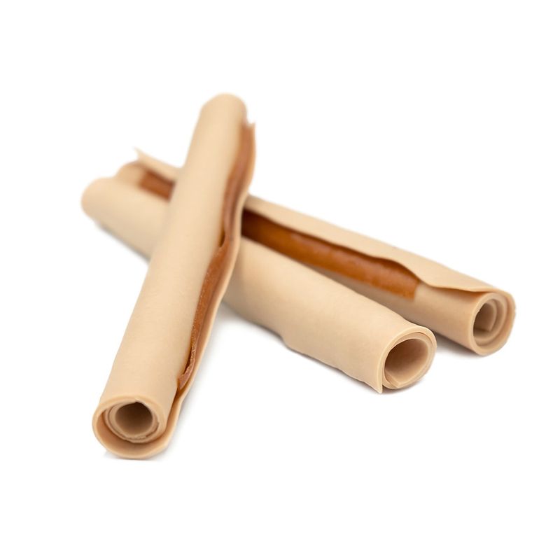 Three rolled dog chew sticks with light and brown layers, visible on a white background.