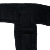 Black padded material with rectangular stitching, close-up of a product.