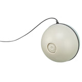 Round play ball with cord, beige colour, visible rotation mechanism. Suitable for interactive play.