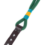 Green dog lead made of braided rope with yellow-blue accents and brown leather handle with metal studs.