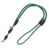 Green fabric dog lead with brown leather details and metal carabiners.