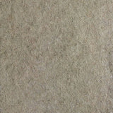 Close-up of a beige-brown felt surface, material texture visible.