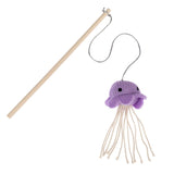 Play rod with wooden stick and purple fabric jellyfish, equipped with long white threads as tentacles.