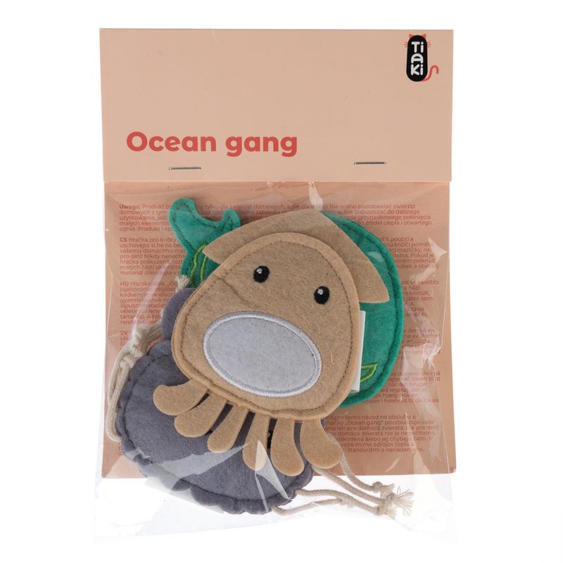 Tiaki Ocean Gang. Fabric toy set with sea motifs, packed in a transparent bag. Visible: brown octopus and green felt fish.