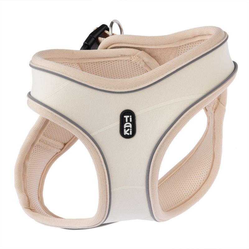 Tiaki beige dog harness with breathable mesh fabric and reflective strips, suitable for secure hold and comfort.