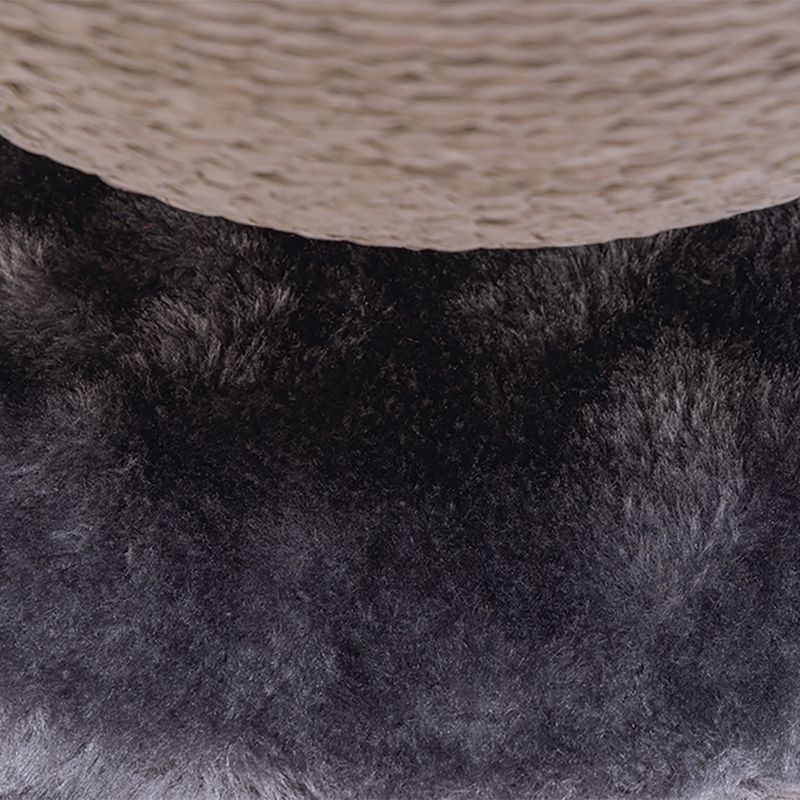 Close-up of a scratching post part with black plush and beige sisal rope.
