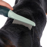 Fine-toothed grooming comb being used on short, dark animal fur to remove loose hair or debris.