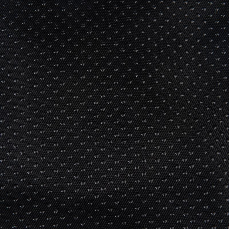 Close-up of black textured fabric with small dots. Material details for product description.