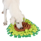 Dog sniffs a green and brown fabric snuffle mat, suitable for search games and activity.