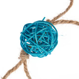 Toy made of blue plastic mesh in a ball shape, attached to a natural fibre rope.