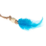 Toy made of jute rope with wooden bead and blue feather.