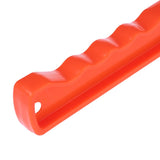 Orange plastic handle with ergonomic waves and hole for attachment.