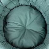 Round, padded cushion in green fabric with a soft surface and central seam.