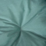 Close-up of green fabric with fine weave texture and a central crease.