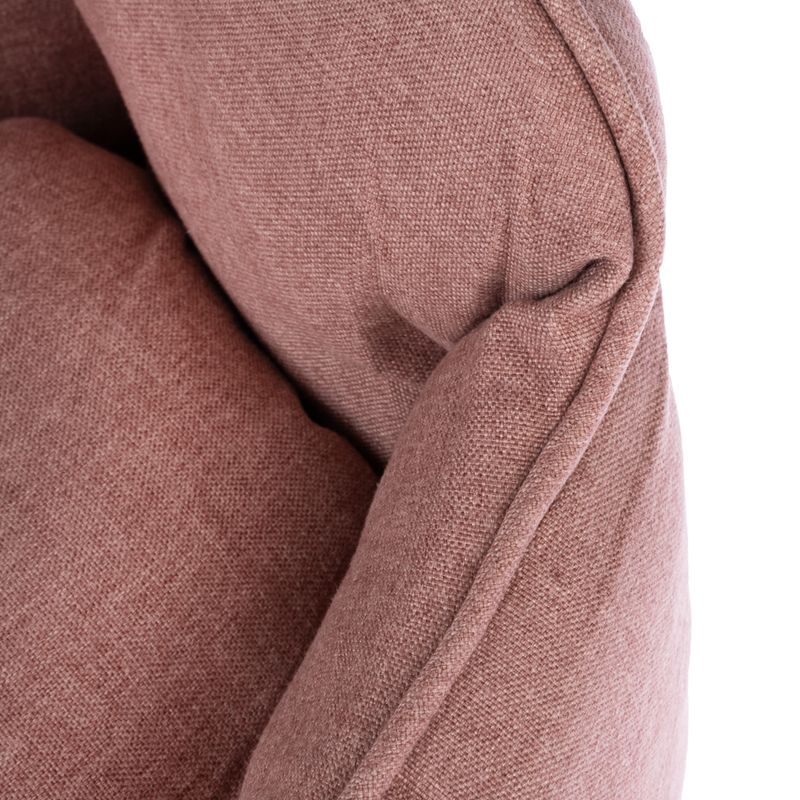 Close-up of a pink fabric cover with visible padding and stitching.