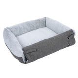 Grey rectangular pet bed with soft light grey padding and fabric cover. Visible logo: Trixie.