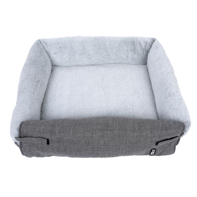 Rectangular grey pet bed with soft light grey plush interior and raised edge. Visible 'TR' logo on the front.