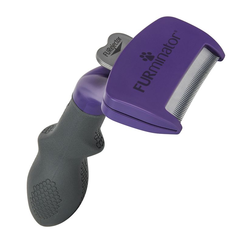 Grooming tool with a purple head labelled FURminator and a grey handle, featuring metal teeth and a button marked FUREjector for removing collected hair.