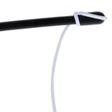 Black rod with white string, close-up of a toy part.