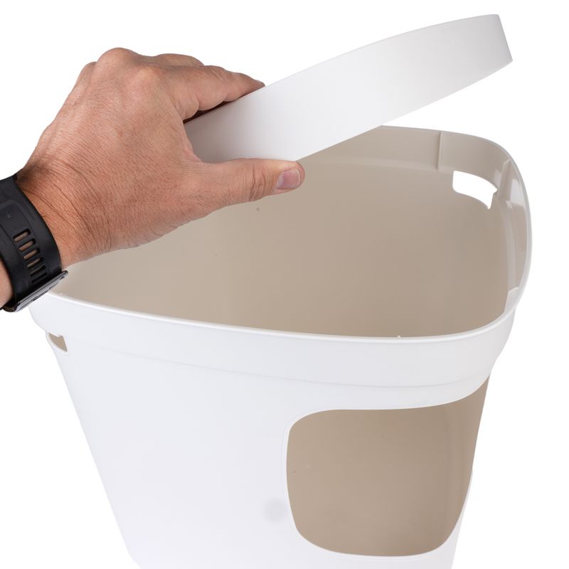 Hand opens white container with removable lid, suitable for storing pet food or accessories.