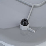 Close-up of a grey plastic lid with black rubber stopper and fastening element.