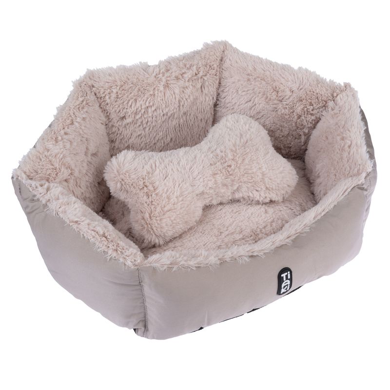 Beige, fluffy pet bed with bone-shaped cushion. 'Tia' logo visible on the outside of the bed.