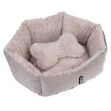 Beige, fluffy pet bed with bone-shaped cushion. 'Tia' logo visible on the outside of the bed.