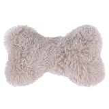 Soft, beige plush toy in bone shape.
