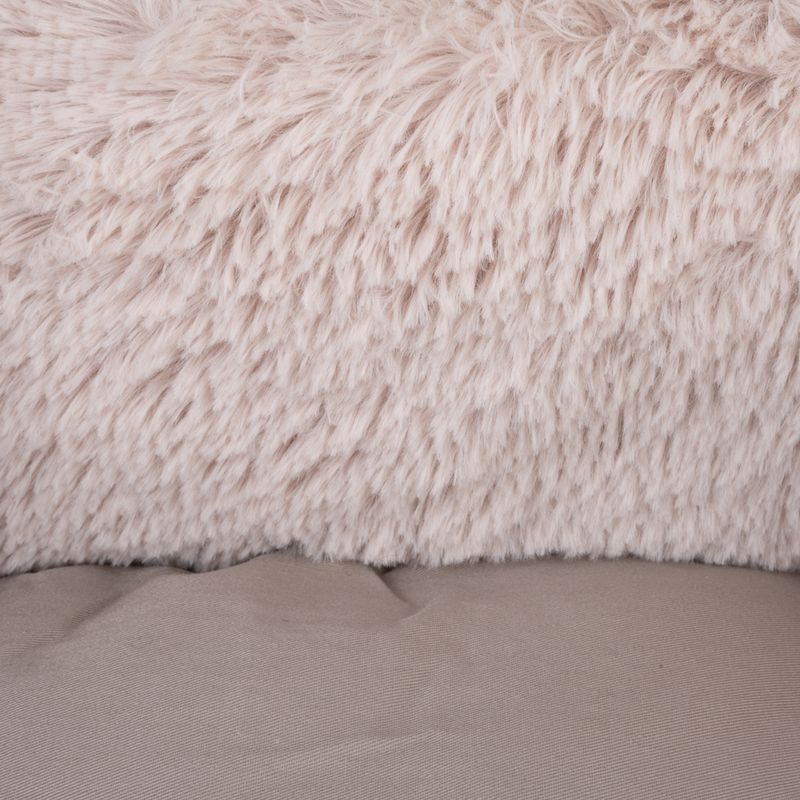 Close-up of soft beige faux fur and smooth fabric in taupe-coloured design.
