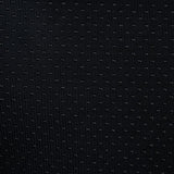 Close-up of black fabric with small, regular dots. Material texture visible.