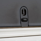Close-up of a black locking mechanism on a product with a white base.