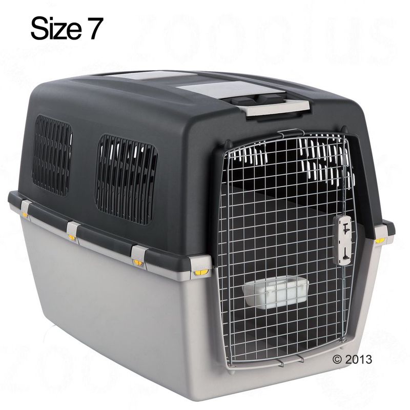 Plastic pet carrier with metal wire door, side ventilation panels, and water bowl inside. Visible text: Size 7.