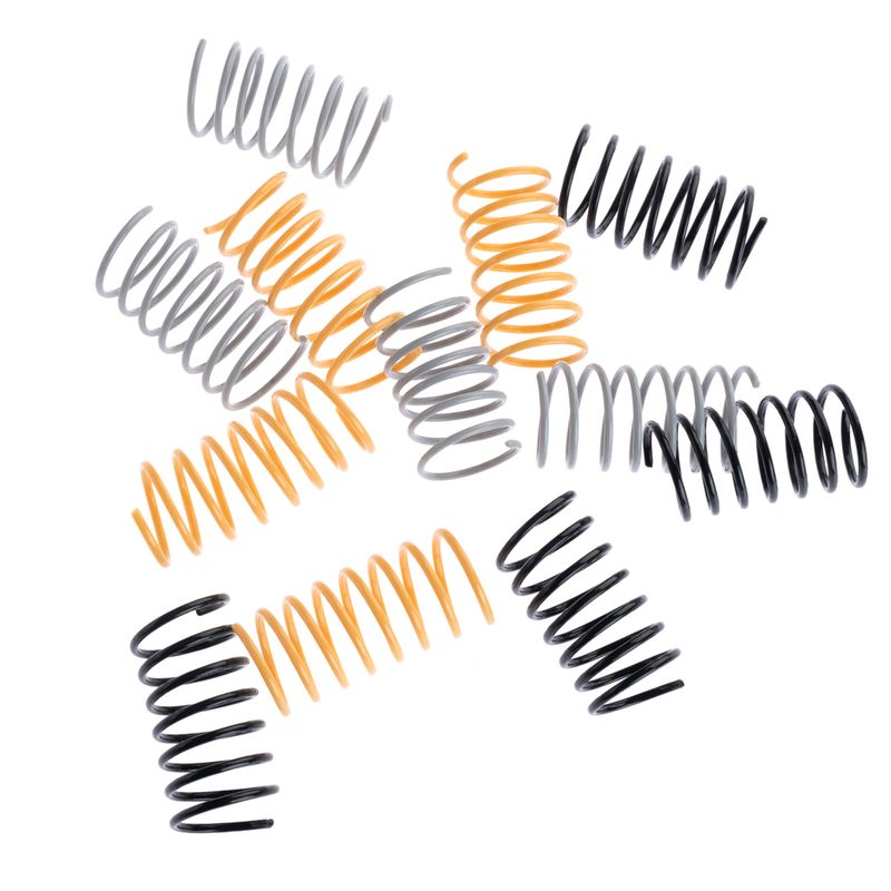Several spiral springs in black, grey and orange. Product accessory for toys or other applications.