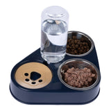 Three-piece food and water set with stainless steel bowls for dry food, wet food and water bottle. Integrated paw-shaped tray in beige.