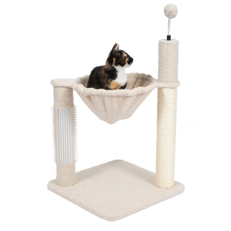 Cat tree with beige hammock, sisal scratching post, brush strip and play ball. Cat sitting in the hammock.