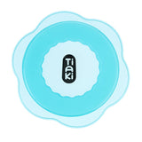 Tiaki. Round blue silicone cover with wavy edge.