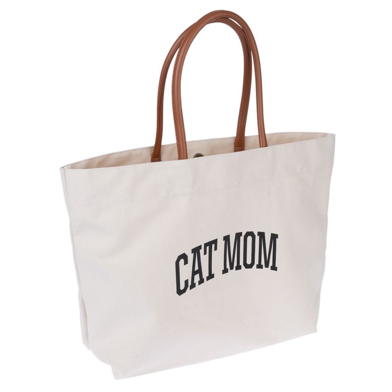 Beige fabric bag with brown handles and black 'CAT MOM' lettering.