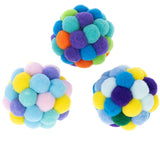 Three colourful play balls made of soft material, consisting of small coloured balls in blue, green, yellow, orange, purple and pink.
