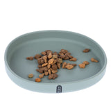 Grey food bowl with dry food, Tiaki brand visible on the front of the bowl.