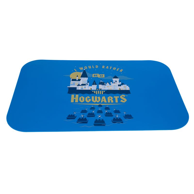 Blue mat with Hogwarts motif and text 'I would rather be at Hogwarts'. Depicts Hogwarts castle and boats on water.