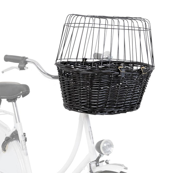 Black bicycle basket made of woven material with metal grid cover, mounted on the handlebar of a white bicycle.