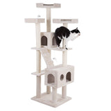 Beige scratching post with multiple levels, caves and toy mice. A black and white cat is playing on one of the platforms.