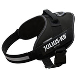 Black Julius-K9 IDC power harness with reflective stripes and sturdy fastener. Visible brand name: Julius-K9.